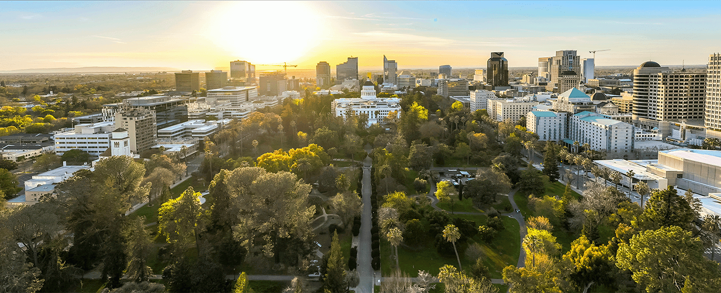 Sunrise aerial view of cityscape with park